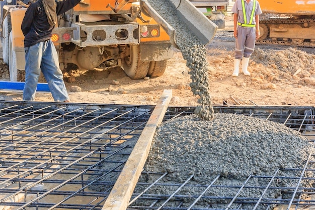 Premium Photo | Concrete pouring during commercial concreting floors of buildings in construction site.